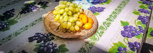 Load image into Gallery viewer, This rectangular cream colored acrylic coated cotton tablecloth measuring 84 inches in length celebrates vineyards and spring, with a beautiful motif of purple grape clusters and leaves. Le Cluny, made in France. Easy care wipe clean finish.
