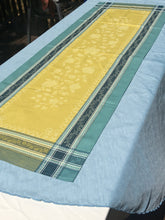Load image into Gallery viewer, Anti-stain teflon treatment allows for liquids to bead off. Measures 20.5 by 58 in. Pictured on a 72 inch length table for reference, but may be draped over the sides of a smaller table as well. Pictured in ramatuelle absinthe with contrasting yellow at center with dark blue and turquoise at intersecting floral garland borders featuring jacquard woven pomegranate-like baroque floral blooms and beautifully detailed leaves and bouquets of intertwined branching elaborated fleur de lys.
