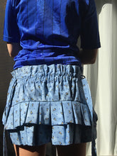 Load image into Gallery viewer, Measures 11 inches in front and 12.75 inches in back. Elastic waistband that can accommodate sizes medium (32" waist) through a large medium (38"). Sits at the top of hips/lower waist. Hand ruched front panel with scalloped barn door straps. Ruffle trims.Tiered pleated flounce at the back.