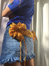Load image into Gallery viewer, One of a kind multi-loop gift bows and drape skirt. 360 hand ruching and ruffle trims. Fits size medium to medium large. Gift bows and sash drape are centerd to back and detachable via snap closures for easy laundering, Elastic ruffle waistband that can stretch 32" to 40". 13.5" in length.
