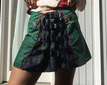 Load image into Gallery viewer, dirndle back multi navy satin bow ruched plaid taffeta upcycled chruistmas napkin waist cuffed pleat flounce school uniform skirt great for holiday winter parties or camp cosplay fashion. Upcycled Christmas nakins are a grid of dark evergreen with bright red woven edges.