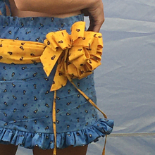 Load image into Gallery viewer, One of a kind multi-loop gift bows and drape skirt. 360 hand ruching and ruffle trims. Fits size medium to medium large. Gift bows and sash drape are centerd to back and detachable via snap closures for easy laundering, Elastic ruffle waistband that can stretch 32" to 40". 13.5" in  length.