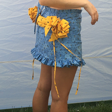 Load image into Gallery viewer, One of a kind gift bows and drape skirt. 360 hand ruching and ruffle trims. Fits size medium to medium large. Gift bows and sash drape are centerd to back and detachable via snap closures for easy laundering, Elastic ruffle waistband that can stretch 32" to 40". 13.5" in  length.