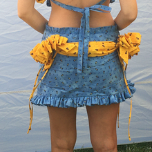 Load image into Gallery viewer, One of a kind gift bows and drape skirt. 360 hand ruching and ruffle trims. Fits size medium to medium large. Gift bows and sash drape are centerd to back and detachable via snap closures for easy laundering, Elastic ruffle waistband that can stretch 32" to 40". 13.5" in  length.
