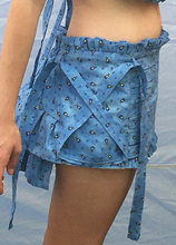 Load image into Gallery viewer, Measures 11 inches in front and 12.75 inches in back. Elastic waistband that can accommodate sizes medium (32" waist) through a large medium (38"). Sits at the top of hips/lower waist. Hand ruched front panel with scalloped barn door straps. Ruffle trims.Tiered pleated flounce at the back.
