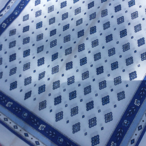 allocver abstract geometric blue ornate motifed lozenge rhombi coordinated in organized grid pattern with floral blue background thin strip layered with light blue and white stripe on border. Provence blue motif overlay on white 100% cotton.Set of 6 napkins