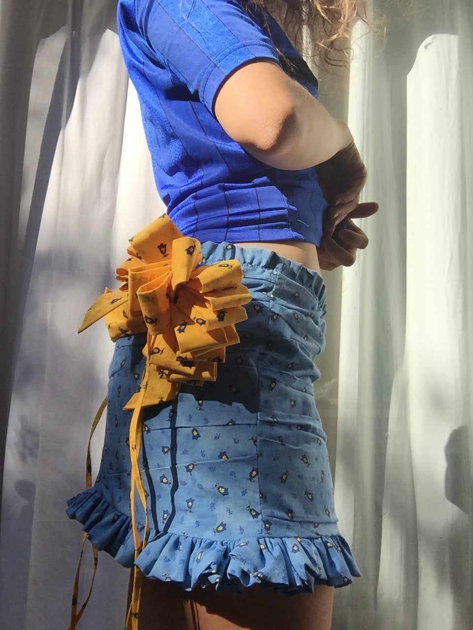 Blue and yellow 20 loop fabric gift bows and drape ruched skirt