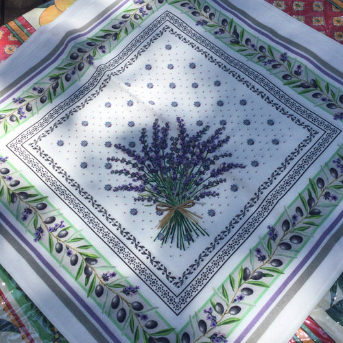 Centered lavender bouquet on a lavender calissons dotted square background bordered by several motif lines includingolive branch trellis. Comes in 100% cotton.
